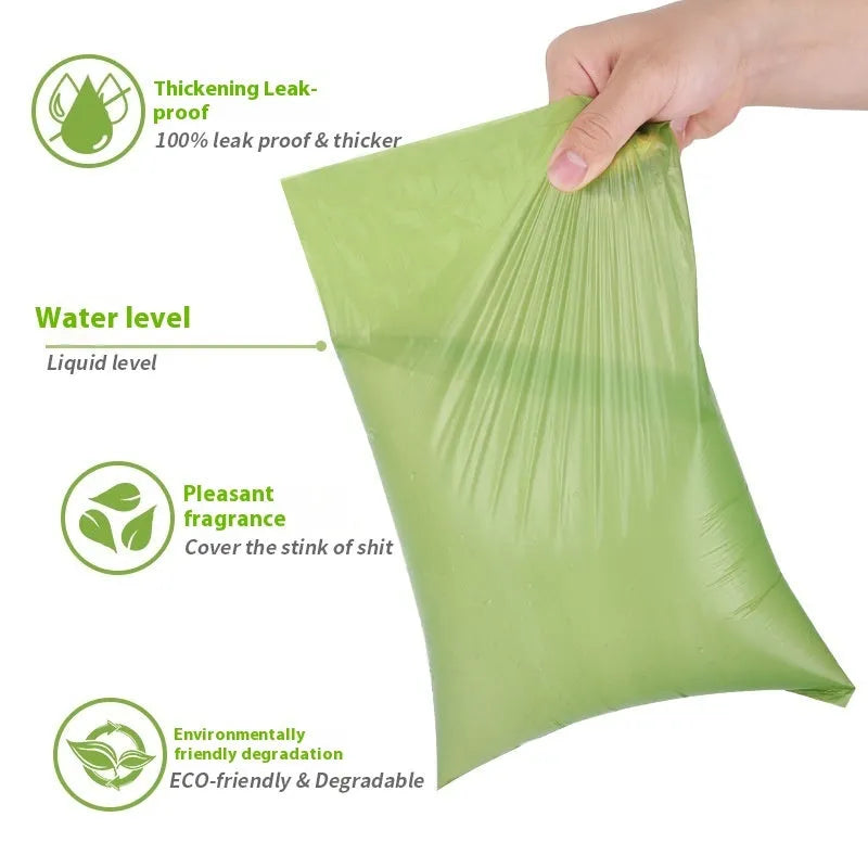 EPI degradable thickened pet waste bags on a roll, showing green colour variant next to a dispenser.