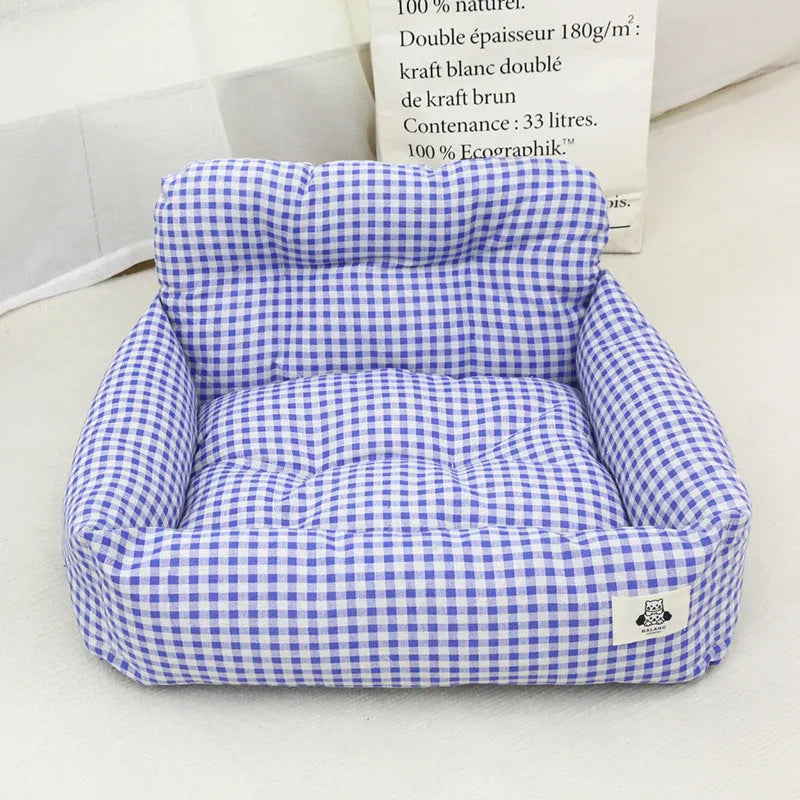 Grey and blue plaid stain-resistant cloth pet nest for car travel, shown in small and large sizes.