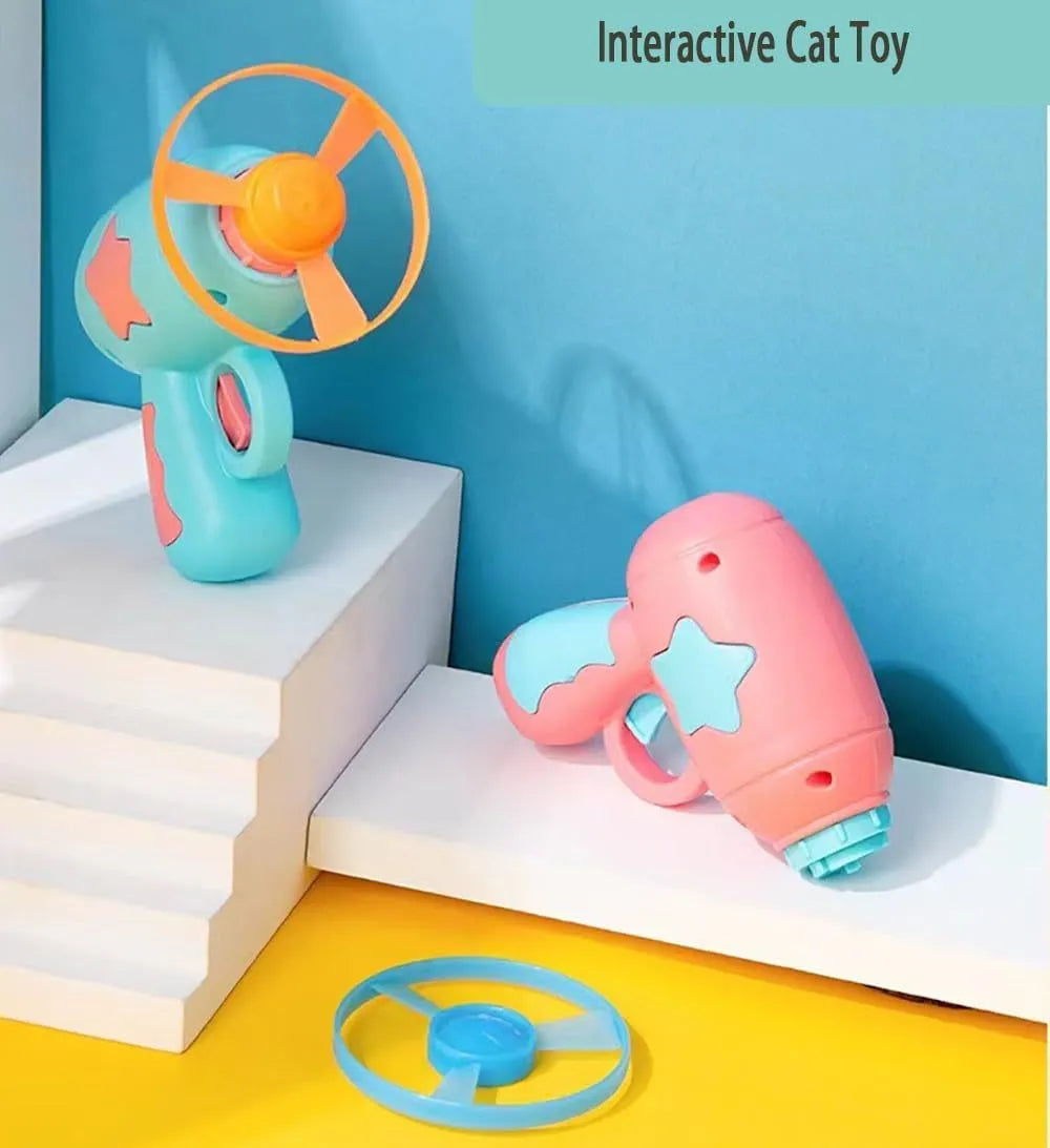 Blue interactive cat toy gun with plastic frisbee on launch mechanism for indoor feline play