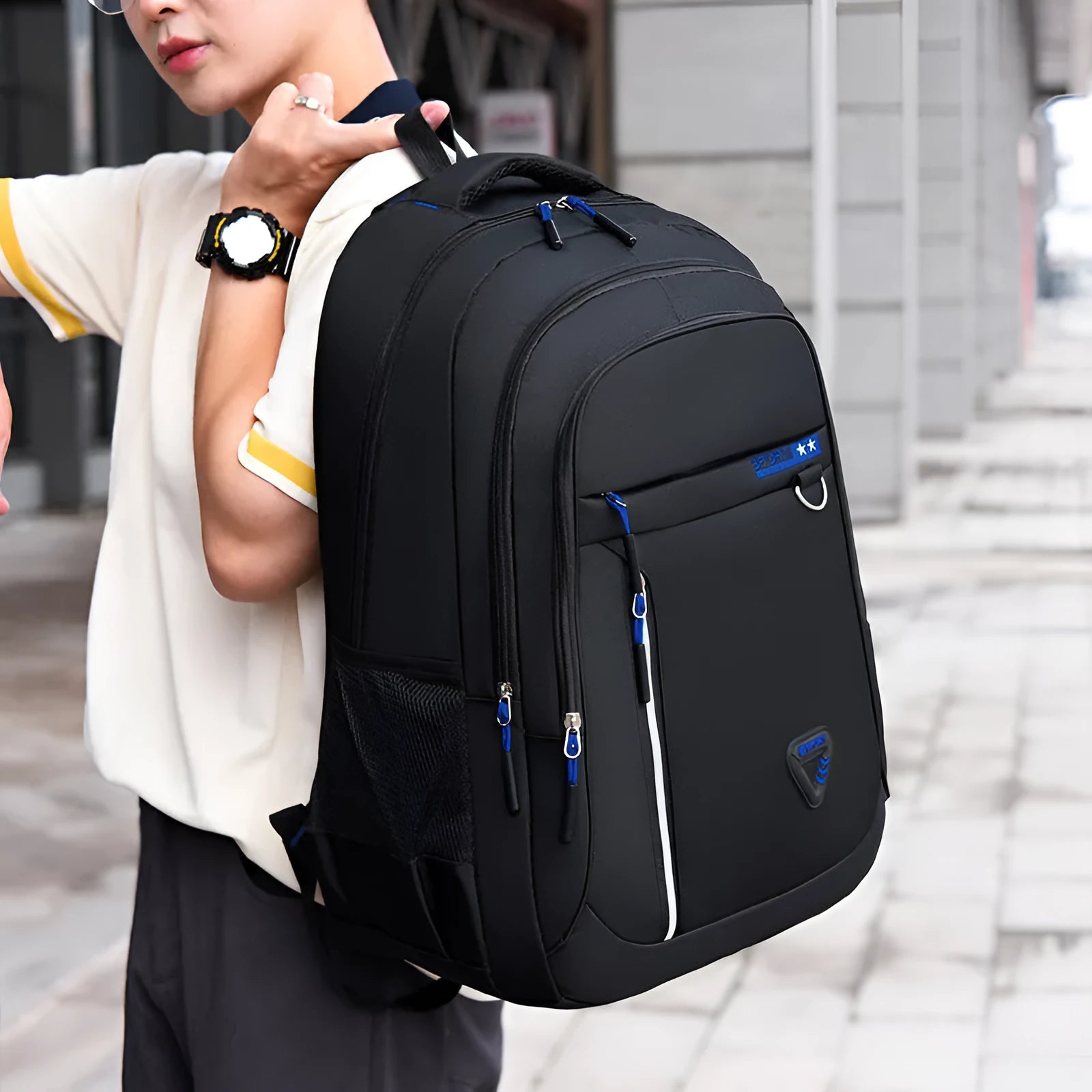 Men's large black Oxford cloth schoolbag with air pillow shoulder straps and splicing design detail.