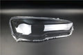 Clear plastic car headlight housing cover with dimensions 50mm by 30mm by 20mm.