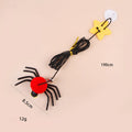Red and yellow cat door toy with elastic rope, feather, bell, and spider dangling for interactive play.