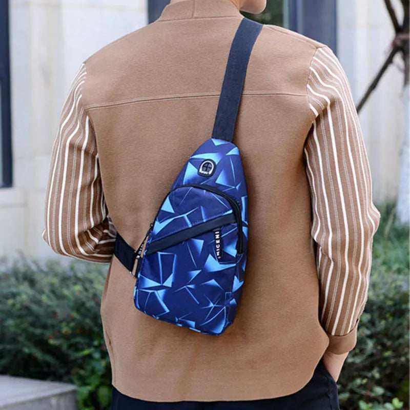 Men's blue crossbody sling bag with earphone hole showing square shape and strap