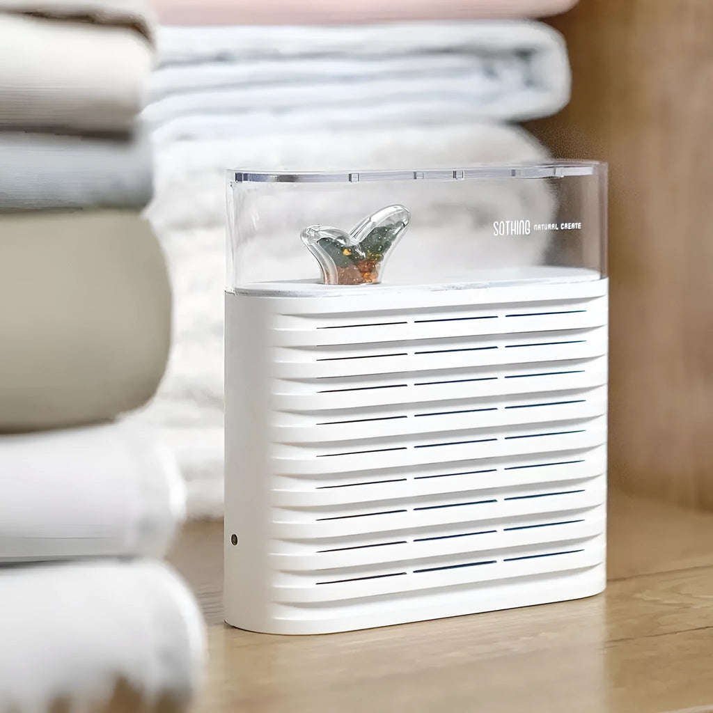 White recyclable cabinet dehumidifier box with clear top showing colour-changing silica gel beads.
