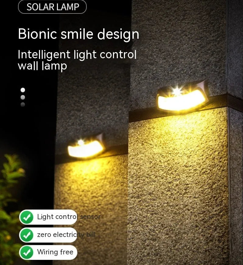 Solar-powered outdoor wall lamp with smiling face design for garden courtyard lighting