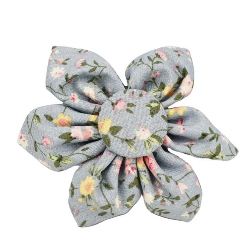 Blue floral patterned cloth dog collar with matching leash and vest set on a white background.