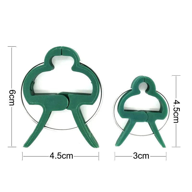 Green plastic and zinc plant fixing clips, showing large and small sizes for supporting climbing vegetables.