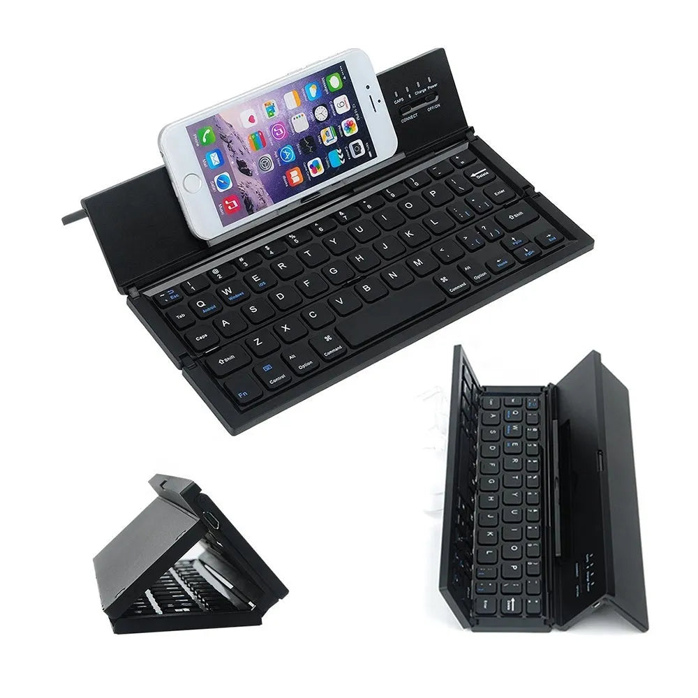 Black foldable ultra-thin wireless Bluetooth keyboard for tablets shown open next to a mobile phone.