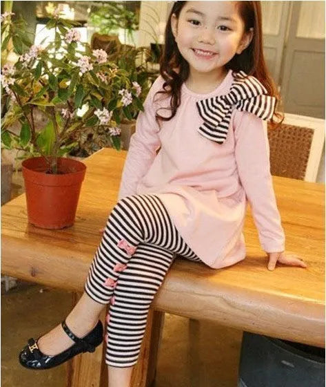 Pink cotton clothing set for girls showing coordinated pieces in children's sizes
