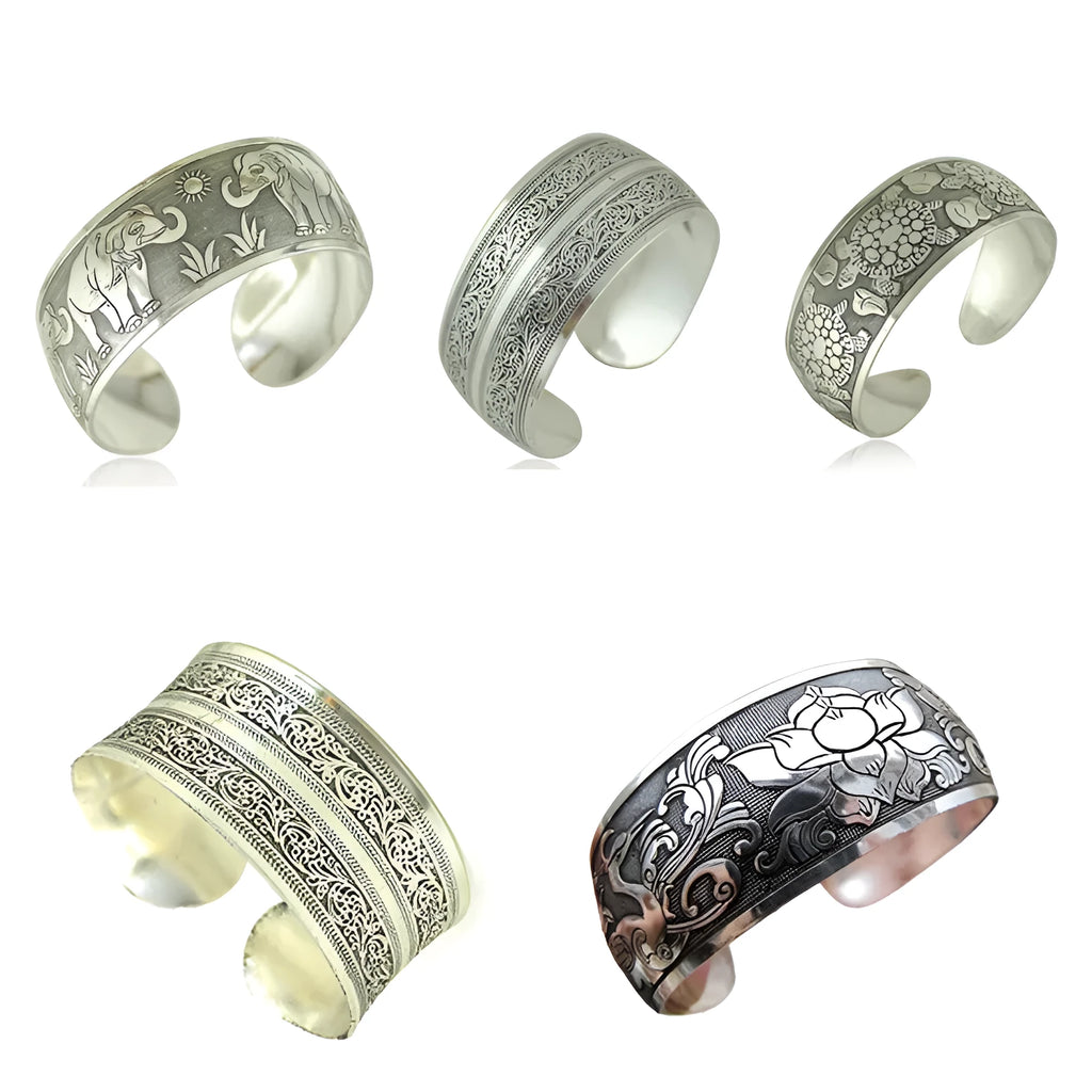 Carved openwork Miao ethnic bracelet in alloy with diamond-cut treatment showing detailed patternwork