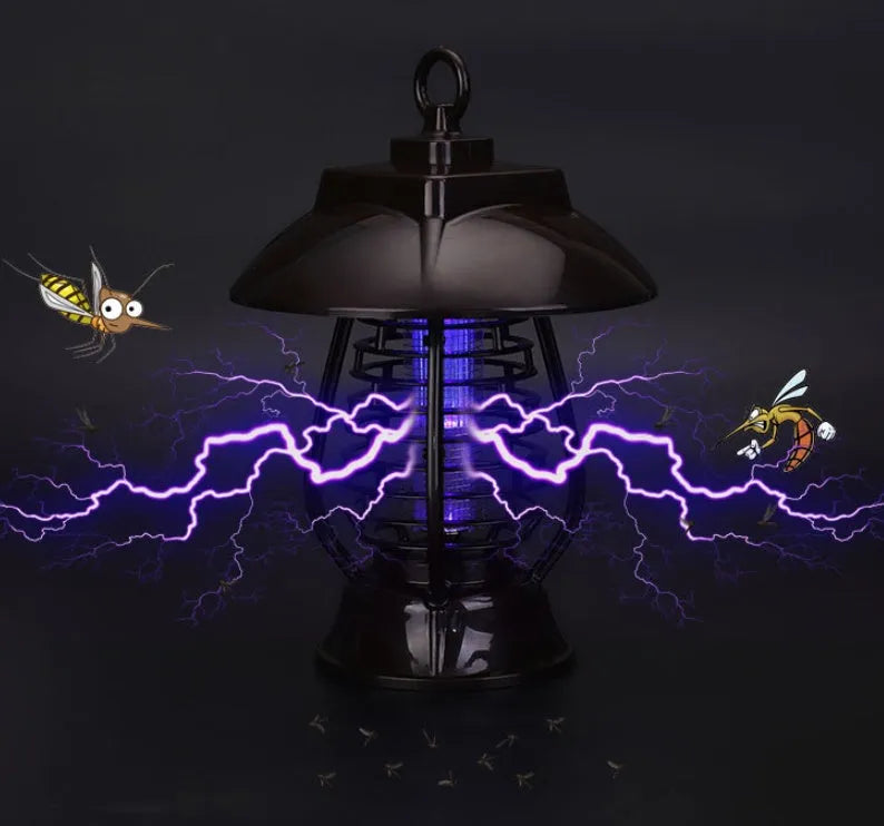 White outdoor solar mosquito lamp with solar panel on top and purple LED light beads visible.