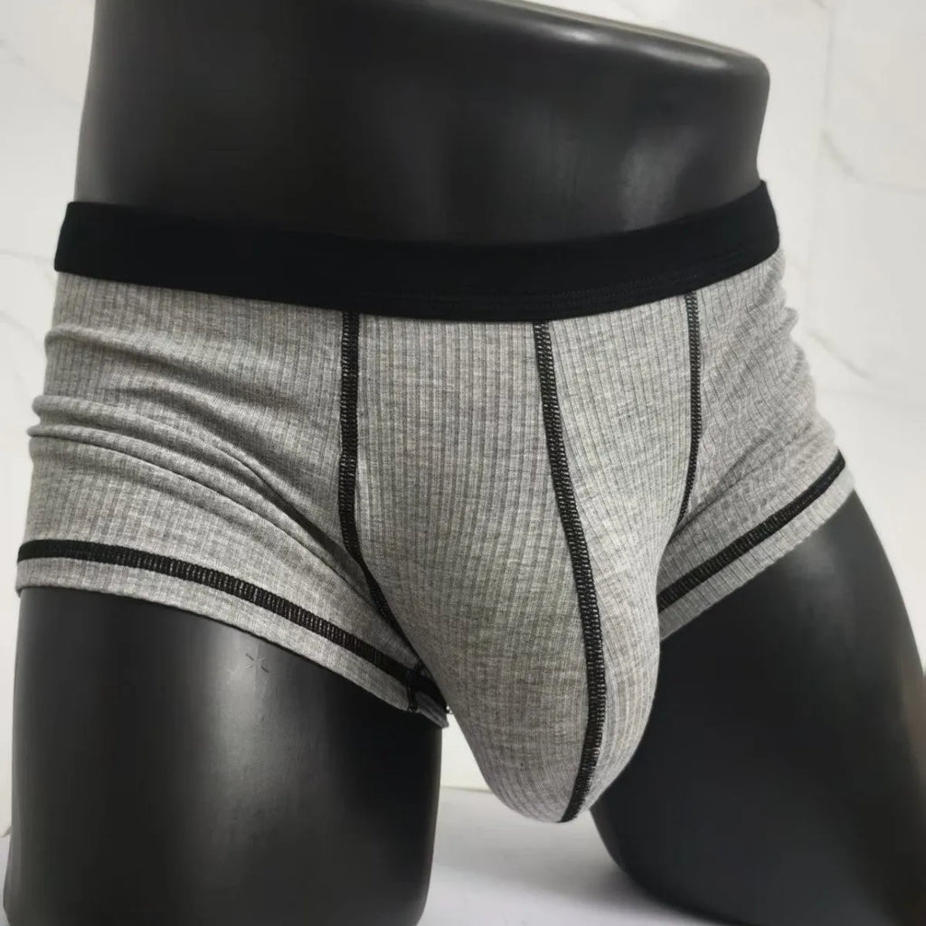 Men's solid colour thin fit boxers showing breathable fabric and body shaping design.