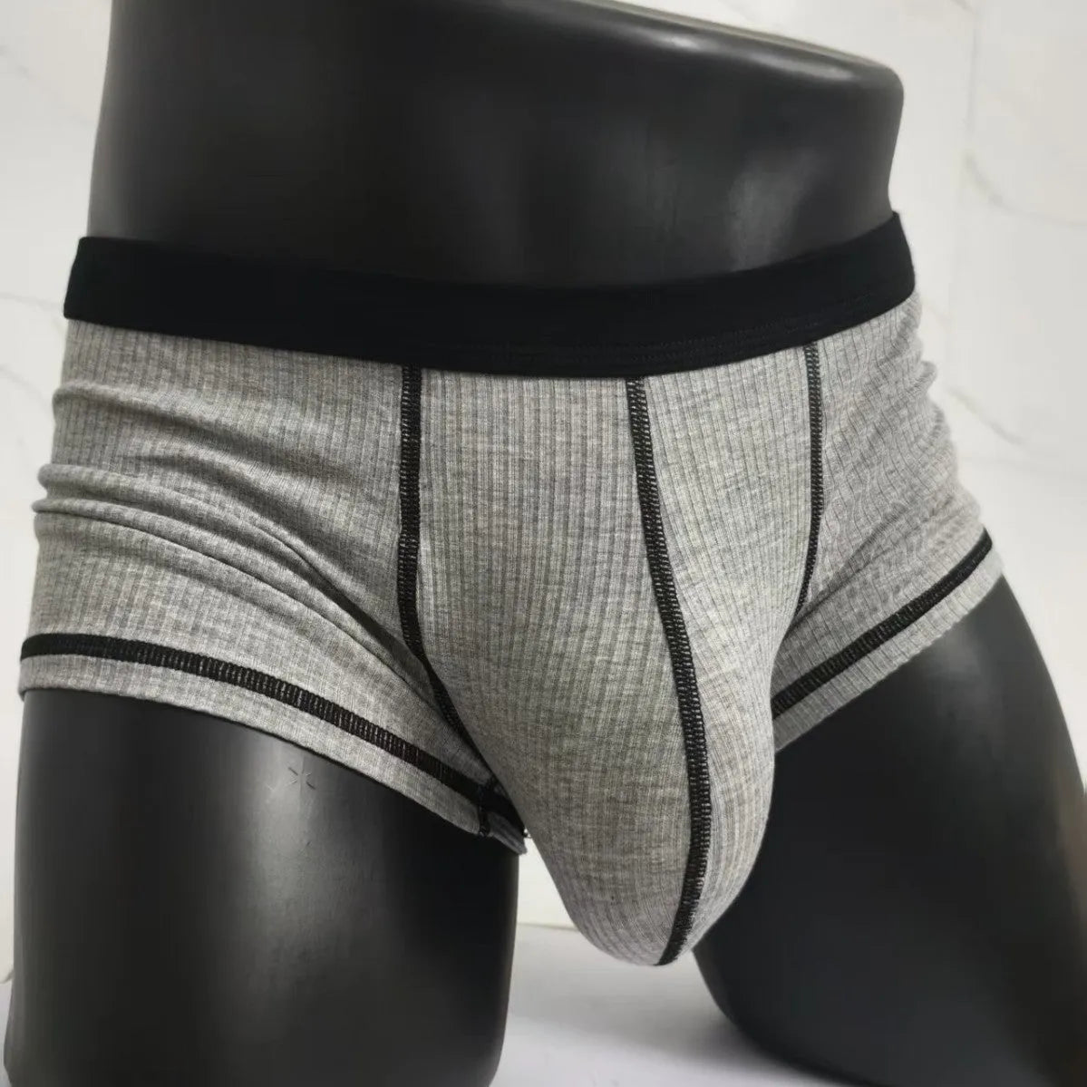 Men's solid colour thin fit boxers showing breathable fabric and body shaping design.