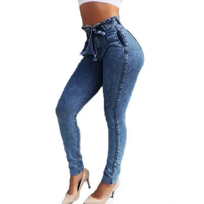 A pair of dark blue fringed jeans made from cowboy denim on a mannequin