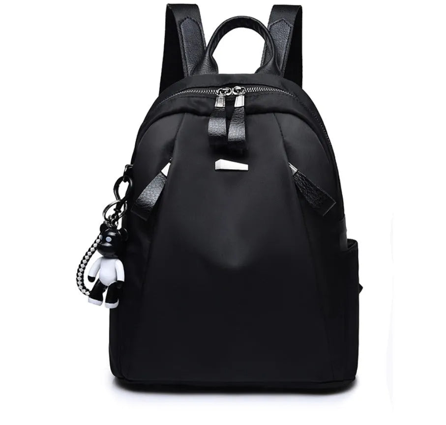 Medium square rucksack in Oxford cloth with dual straps, shown in grey colour with external digging bag.