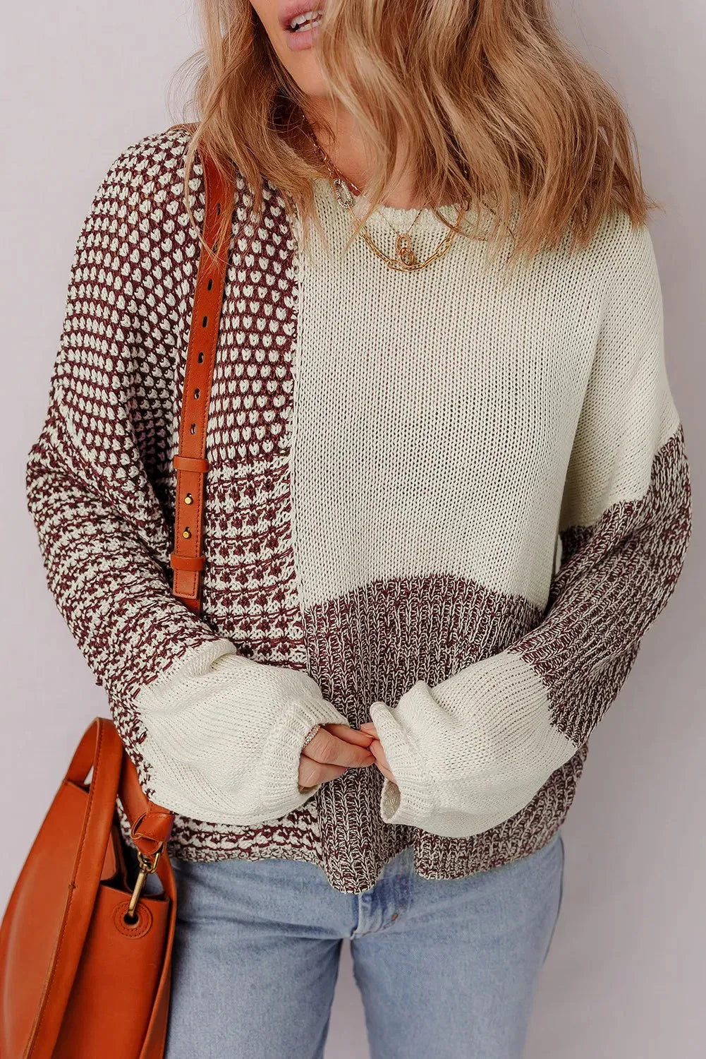 Dark khaki loose knit sweater with drop shoulders and a back tie detail.