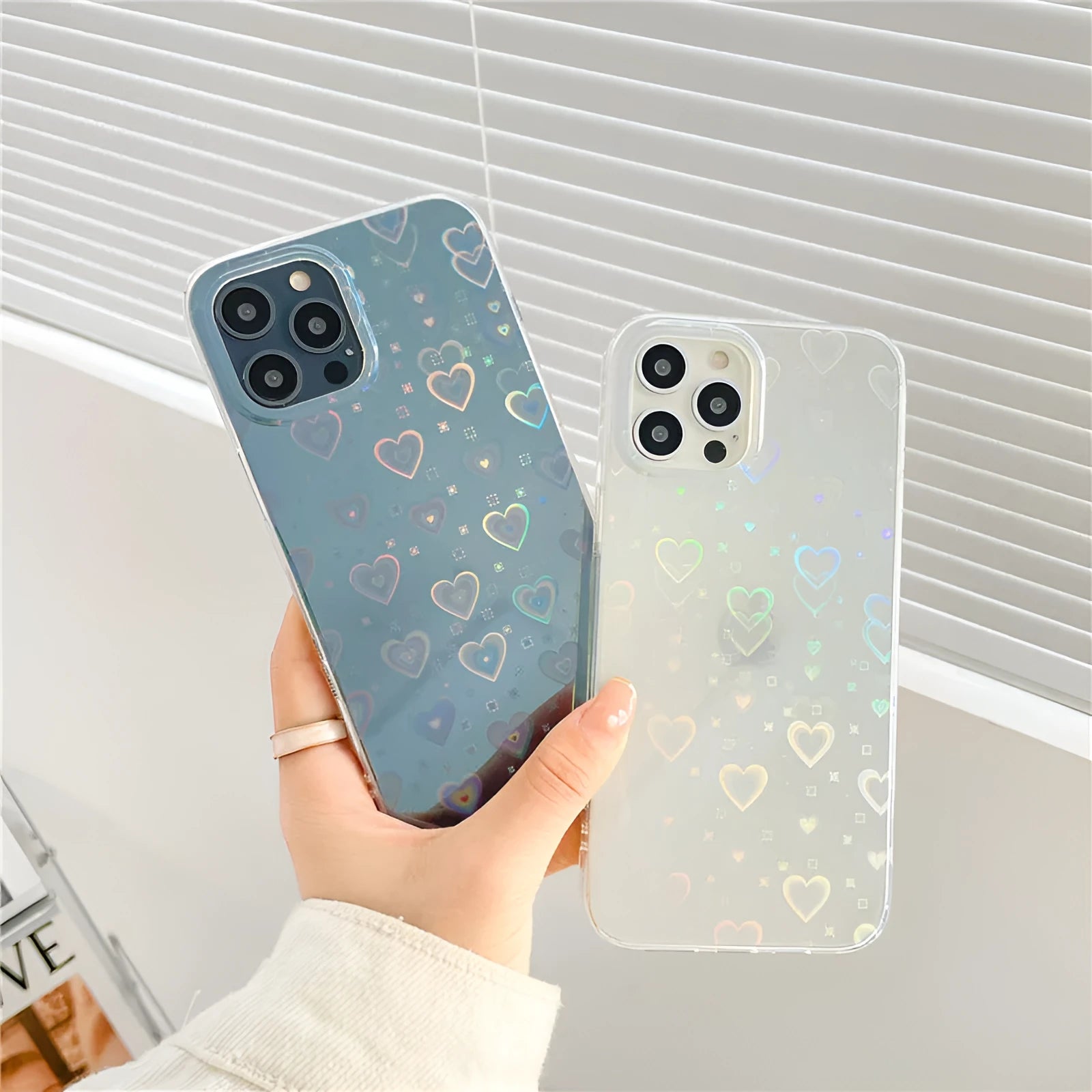 Transparent silicone iPhone case with laser-etched Love design shown on iPhone model