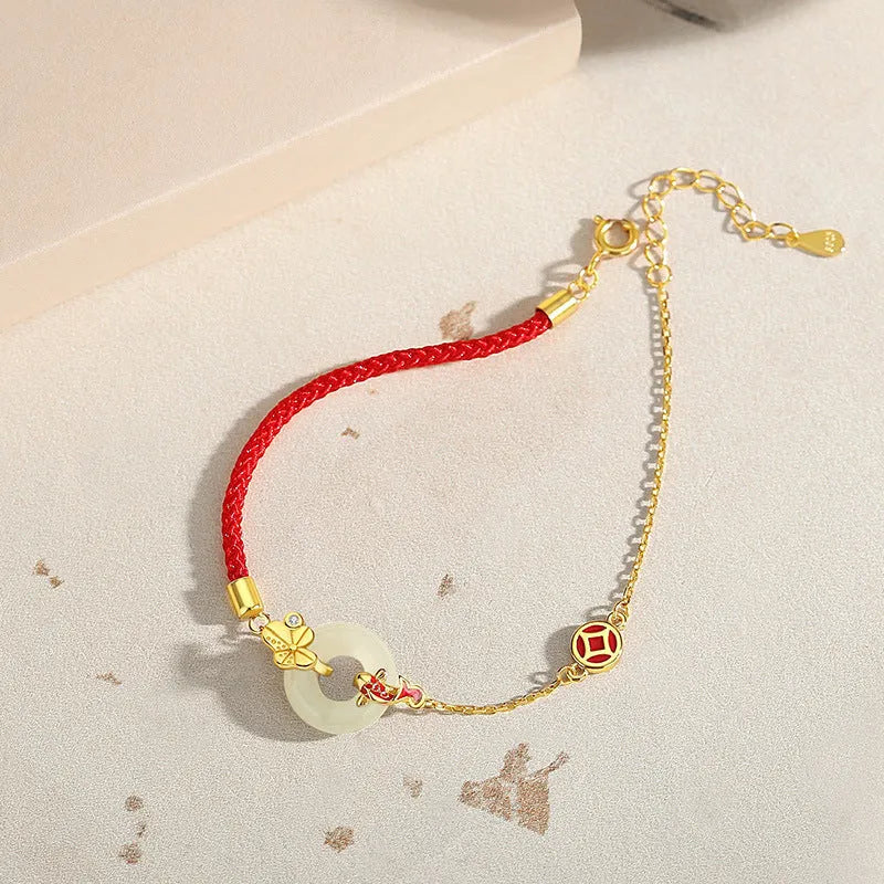 Women's 925 silver bracelet with gold electroplated peace buckle, koi fish charm, and adjustable red rope.