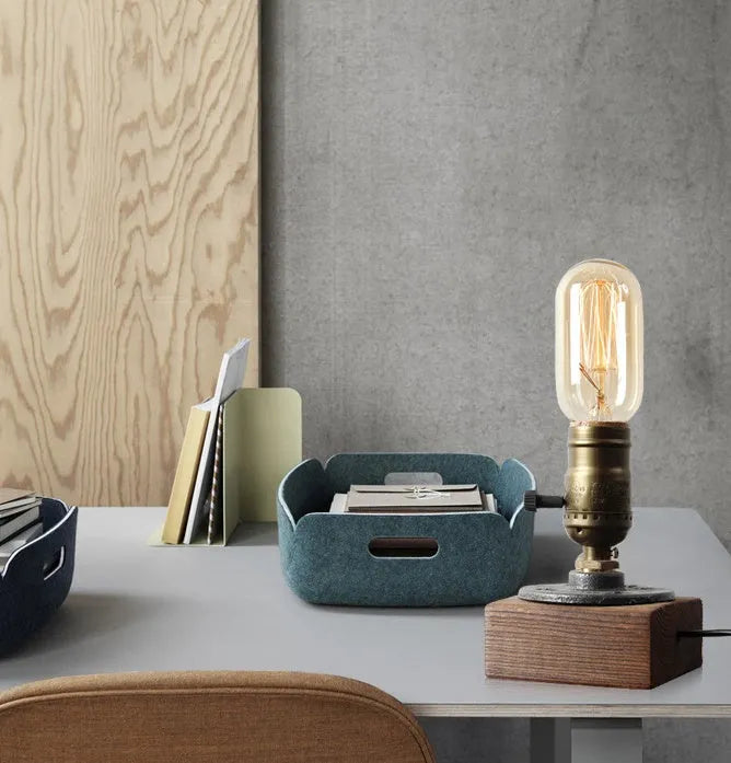 Wood and iron water pipe design table lamp measuring 9 cm wide by 13 cm high.