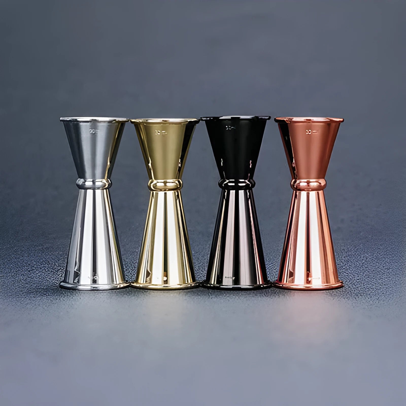 Stainless steel dual-ended cocktail measuring cup and shaker set in silver finish