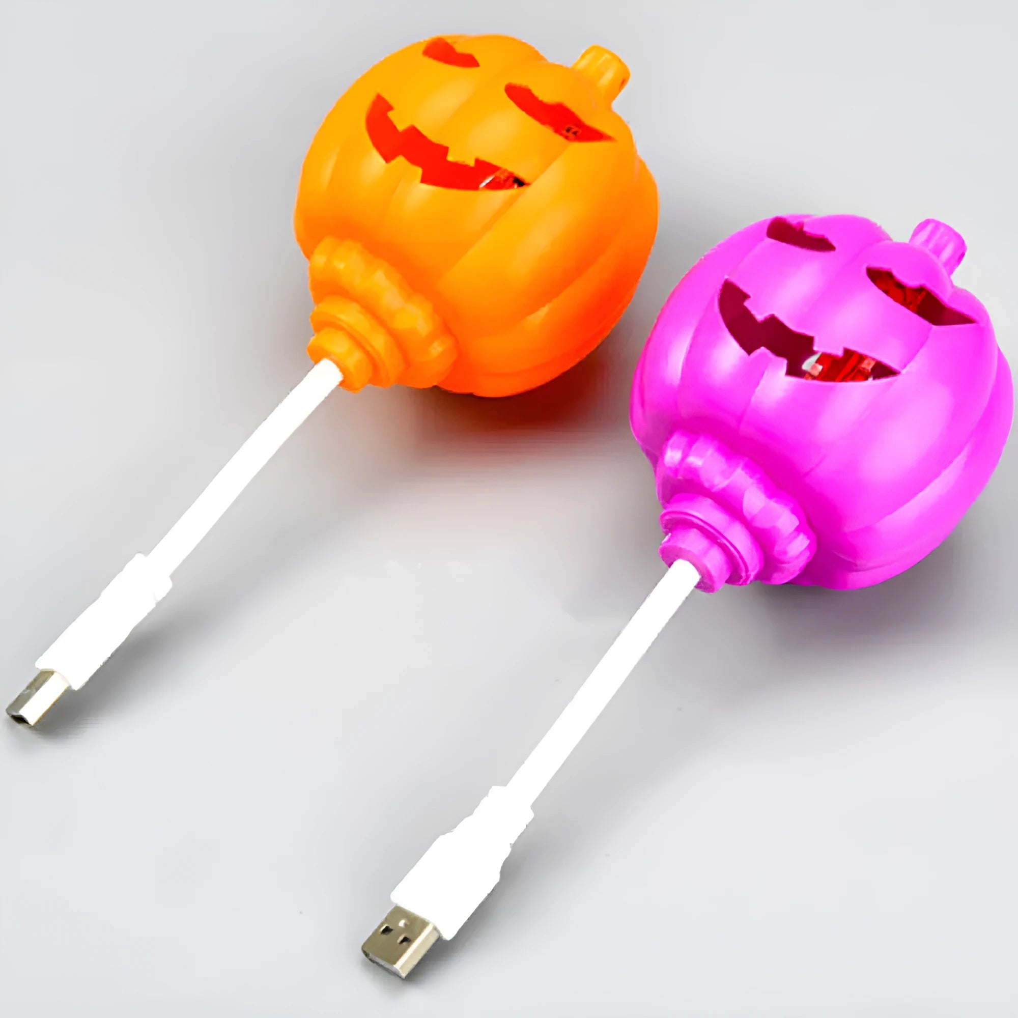 Plastic pumpkin-shaped decorative lamp with purple or yellow light, standing 22cm tall.