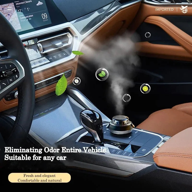 Solar-powered kinetic car air freshener with rotating double rings on a black plastic base.