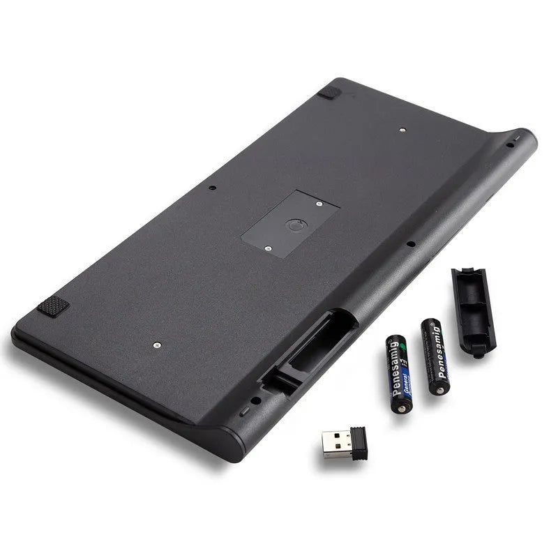 Black wireless keyboard and mouse set on wooden desk showing 2.4GHz wireless operation