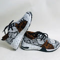 Women's wedge heel flat sneakers in breathable fabric showing round toe and slip-on design