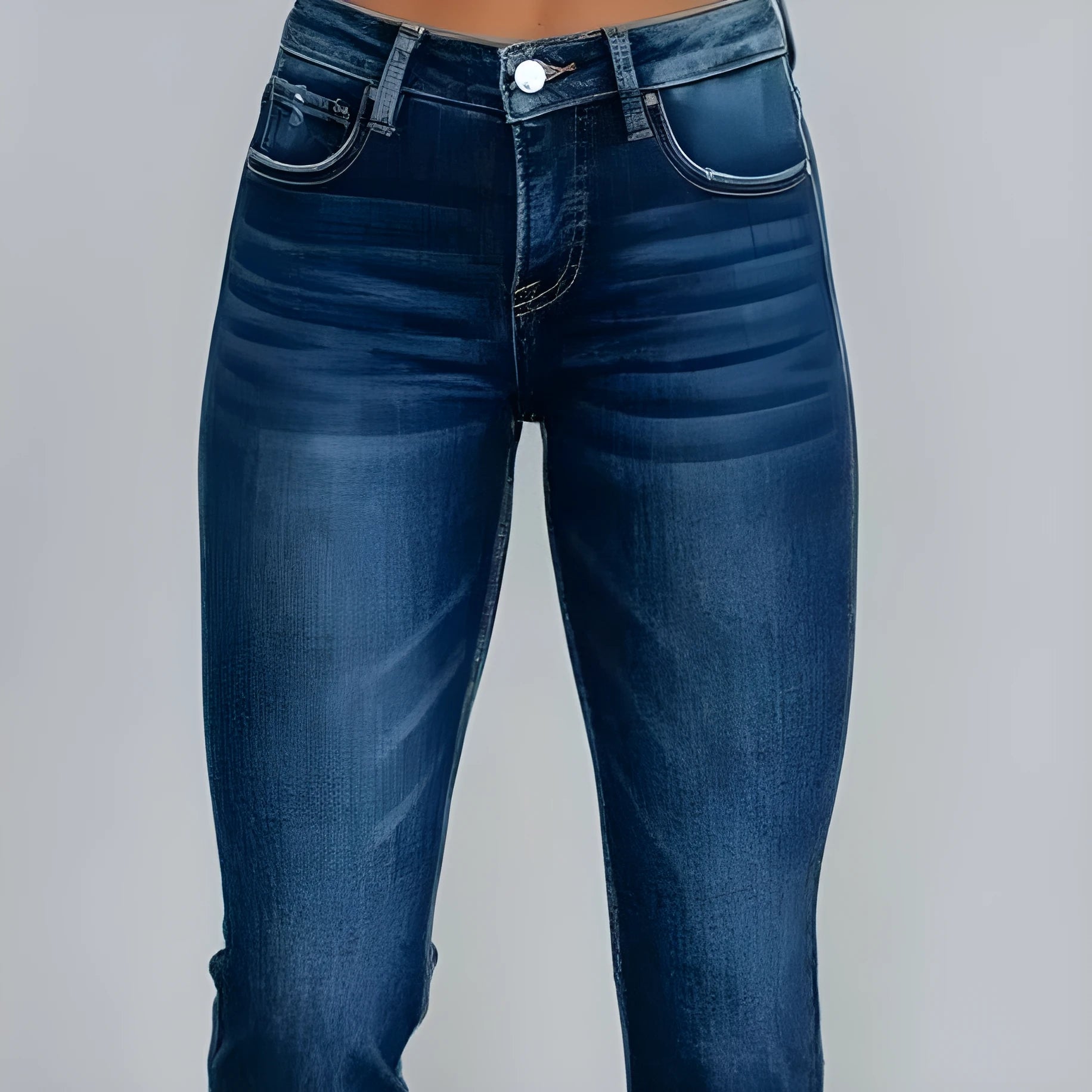 Women's solid colour denim jeans with hand-worn distressing in dark blue on a model