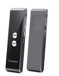 Black wireless voice translator with Bluetooth on white background next to smart phone