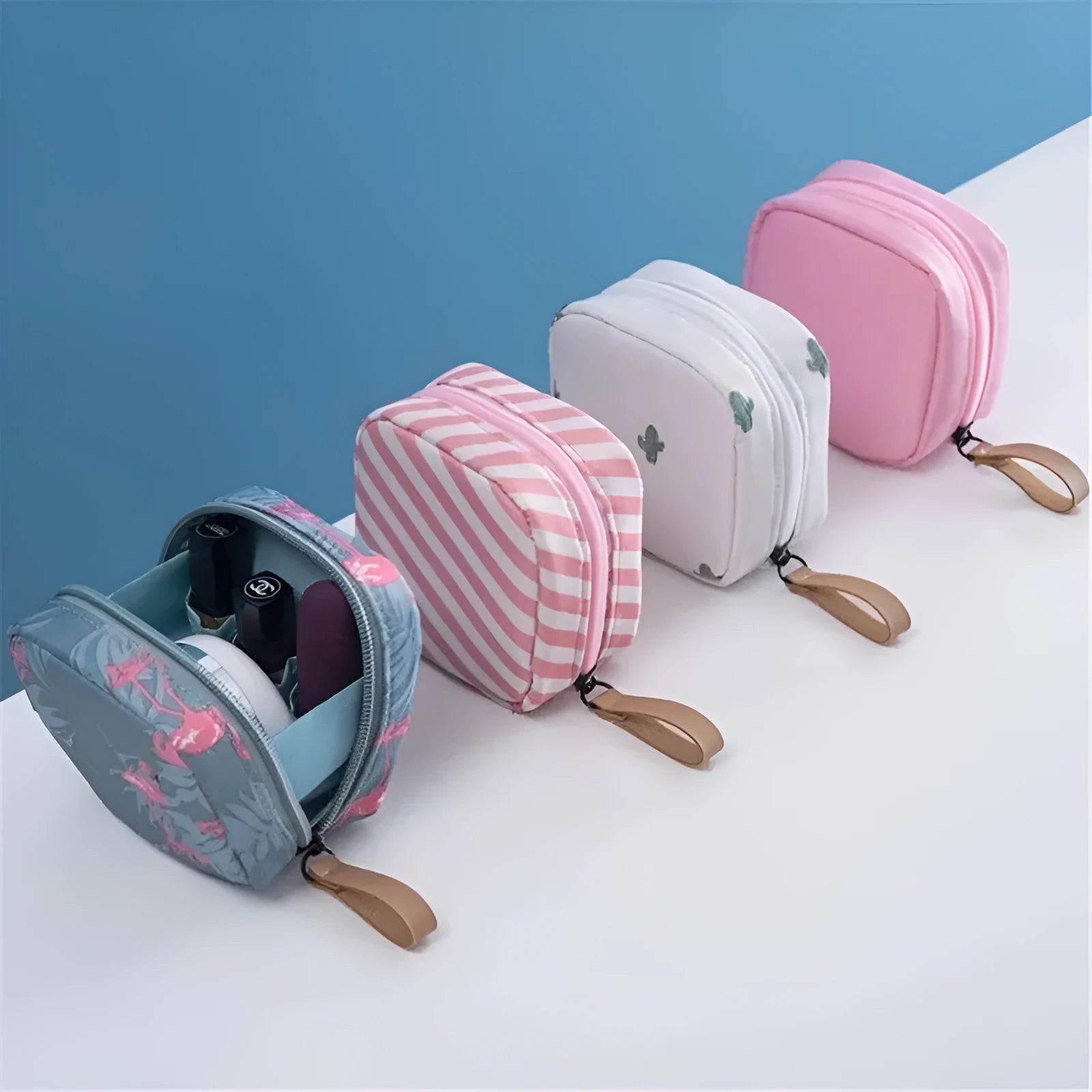 Blue cloth cube makeup storage bag with zip on a bathroom countertop.