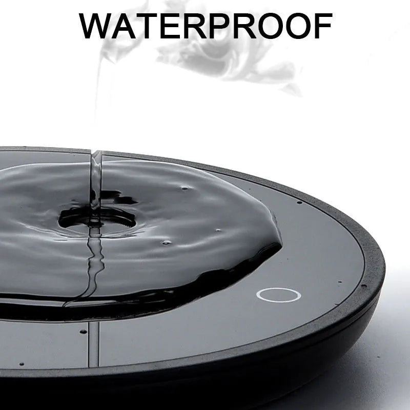 Black coffee mug warmer with dual temperature buttons and 12cm tempered glass heating surface