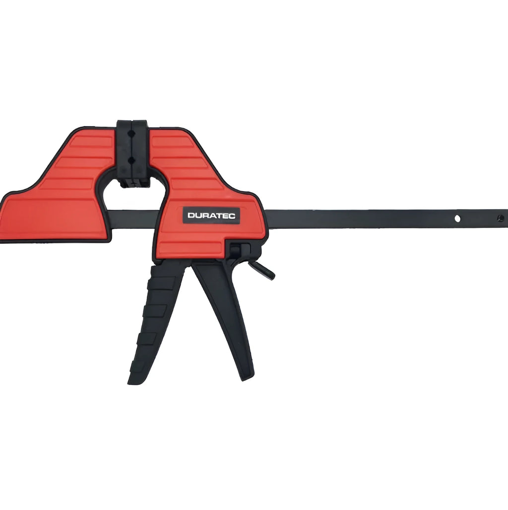 Black plastic woodworking clamp with quick-release lever and rubber grip pads in multiple sizes