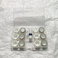 Rectangular contact lens case showing two compartments and colour options