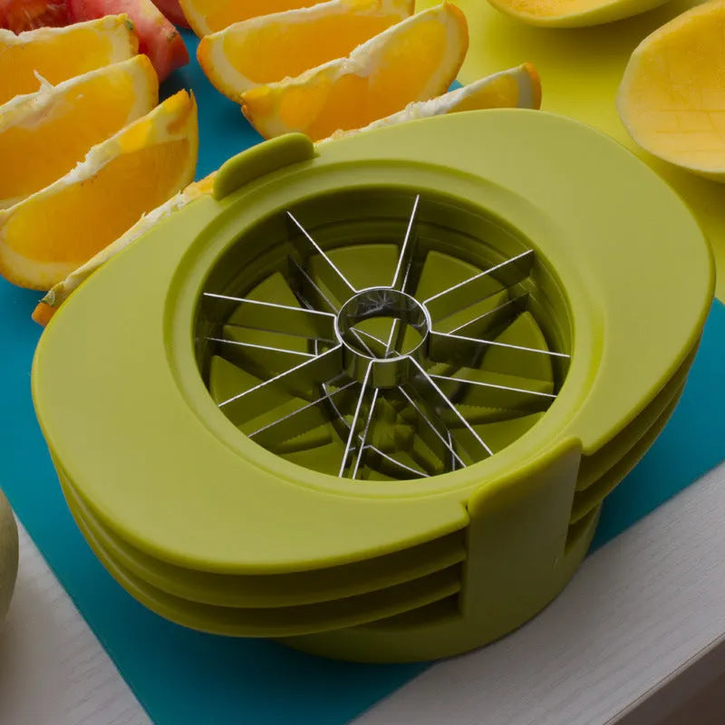 Green kitchen fruit slicer set with apple, tomato, and mango cutters on a stable base