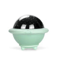 Green UFO-shaped plastic LED night light projecting starry sky pattern on a dark wall