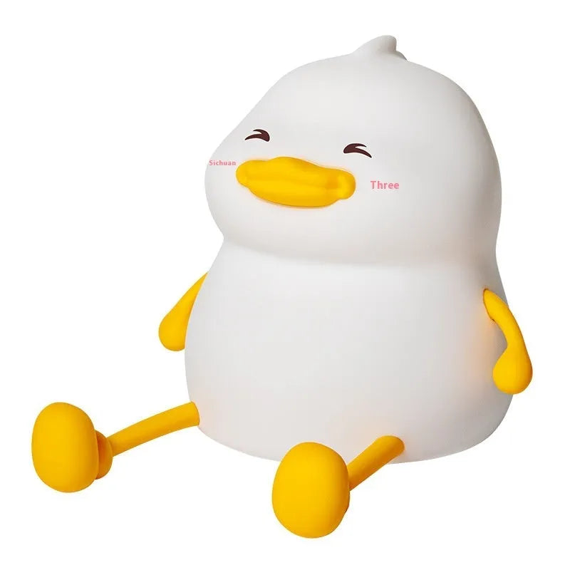 Chubby silicone night light with phone holder slot, showing touch controls and soft LED glow
