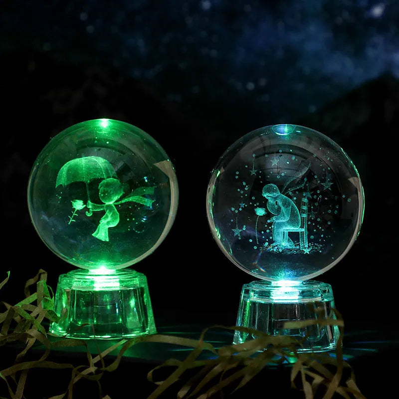 Transparent 6cm crystal ball ornament with internal laser carving and LED illumination on fixed base