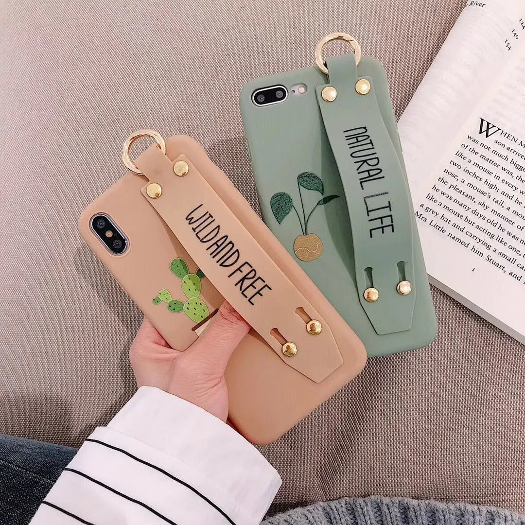 Green graffiti design phone case with a detachable silicone wristband, shown fitted on an iPhone.