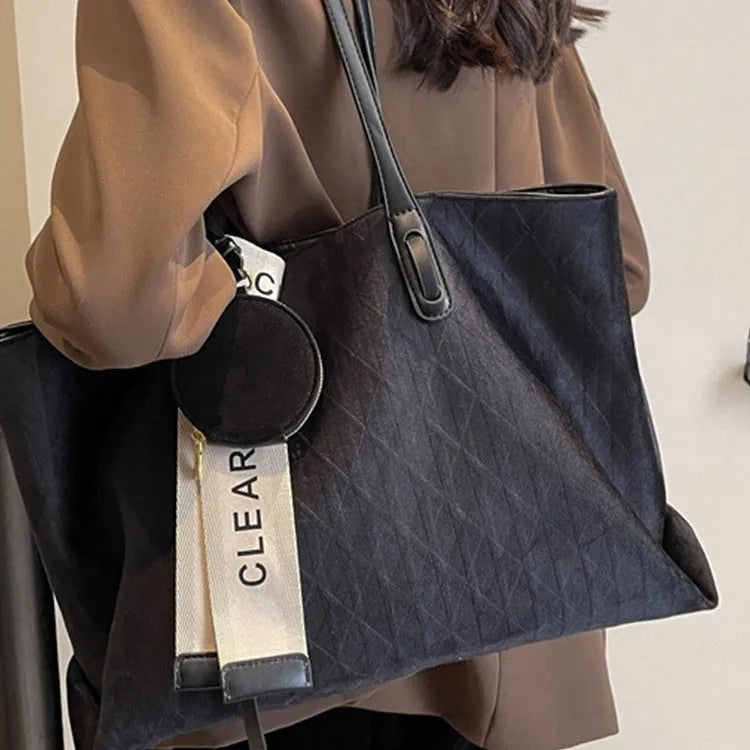 Large capacity polyester shoulder bag in green colour showing horizontal square shape and shoulder strap