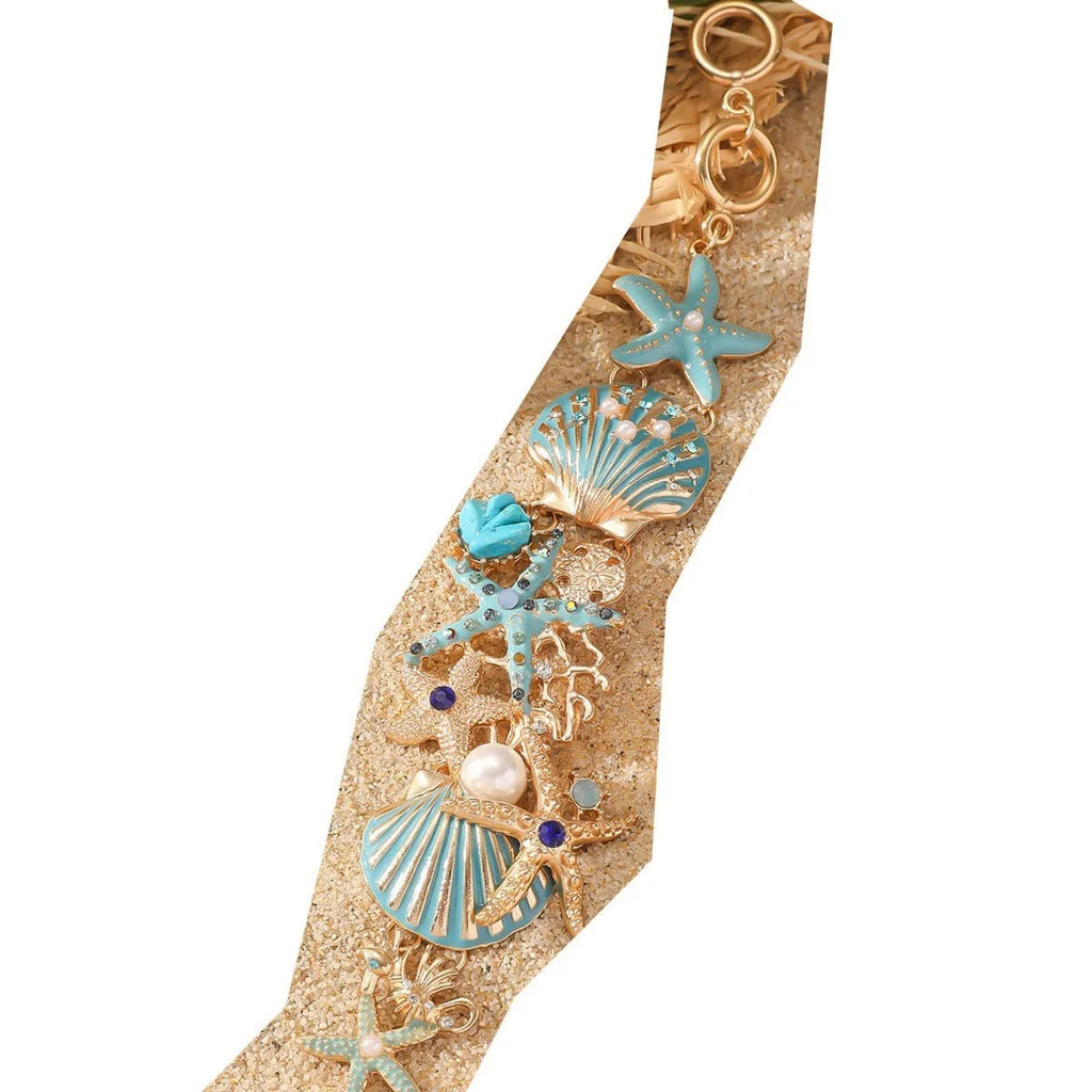 Alloy nautical bracelet with starfish, marine shell and boat anchor charms in turquoise colour