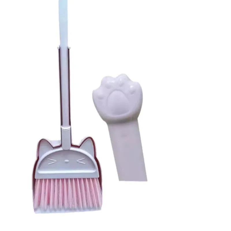 Beige plastic broom and dustpan set standing in a rotating long brush holder.