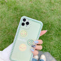 Green TPU iPhone case with geometric smiley face polka dot patterns on a phone