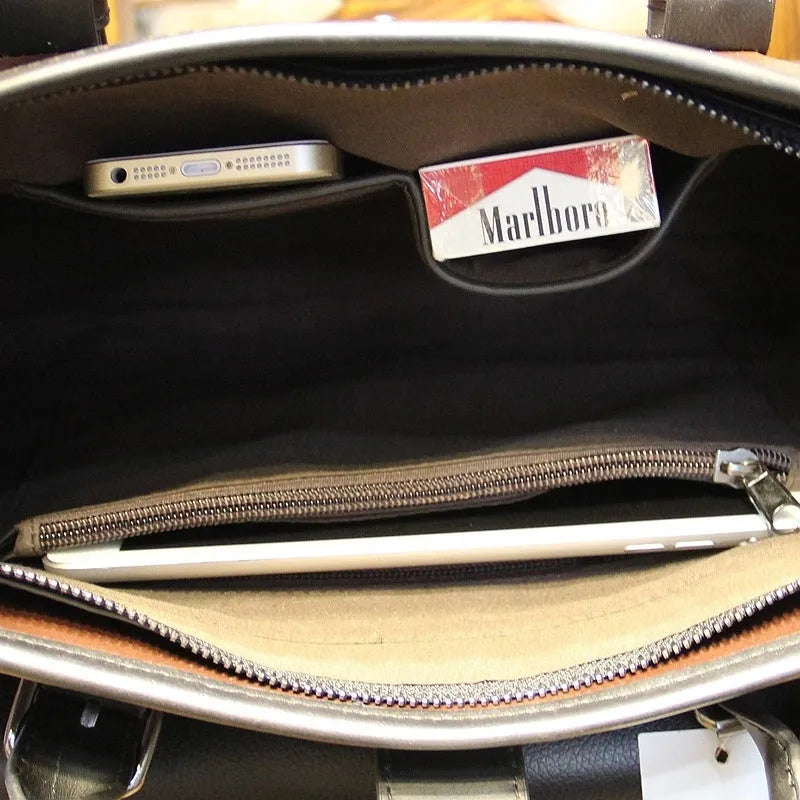 Men's cowhide leather handbag in black with zipper closure and hard handle