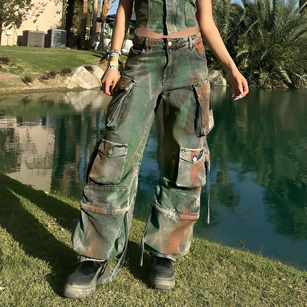 Women's loose cargo denim trousers with a colour bloom wash and gradient colour pockets on a street style background.
