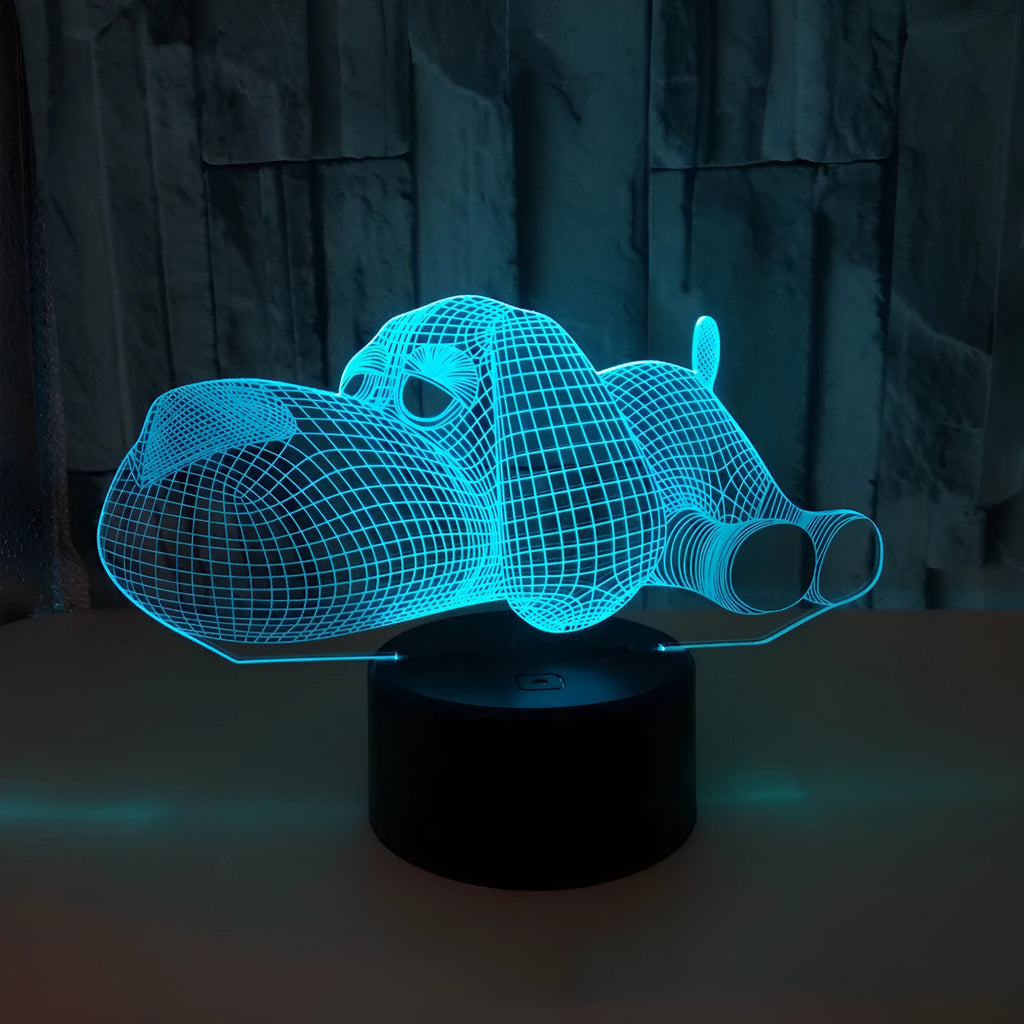 Glowing 3D illusion dog desktop night light showing multiple colour options on a desk.