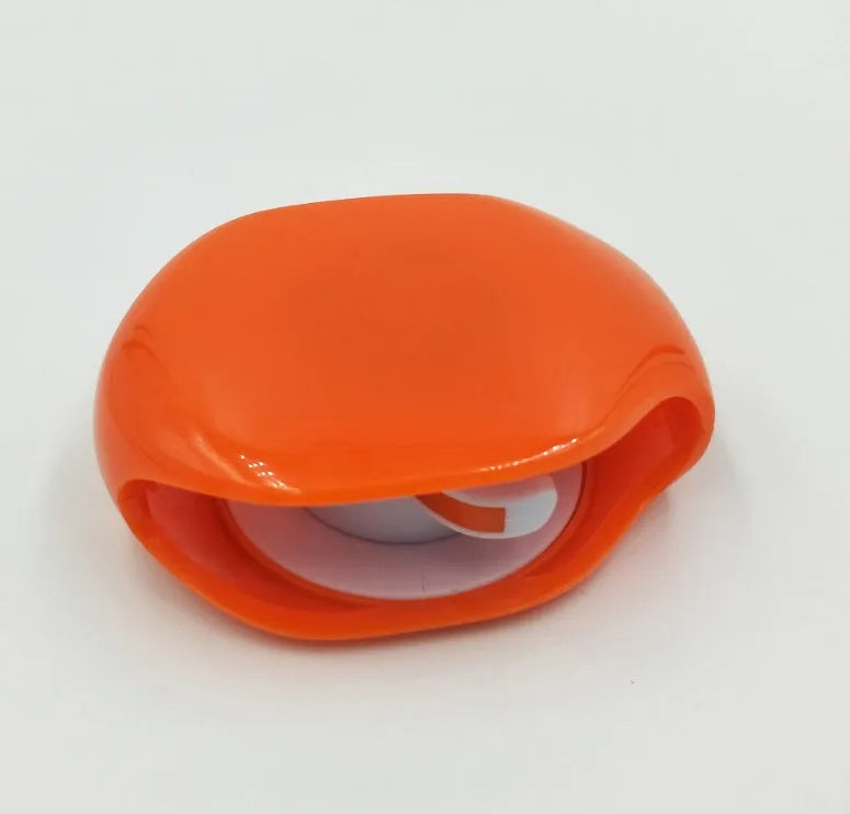 Automatic earphone cable winder retractor in a compact plastic case.