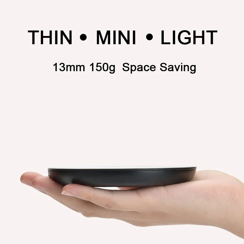 Black coffee mug warmer with dual temperature buttons and 12cm tempered glass heating surface