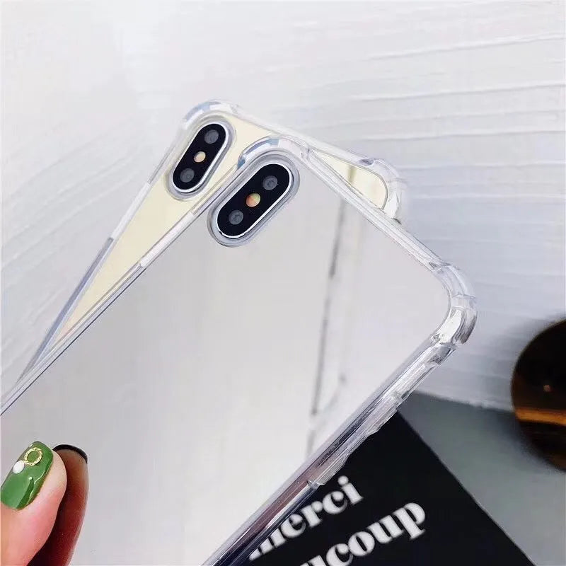 Mirror iPhone Case in various colours including black, blue, gold, rose gold, silver, and transparent.