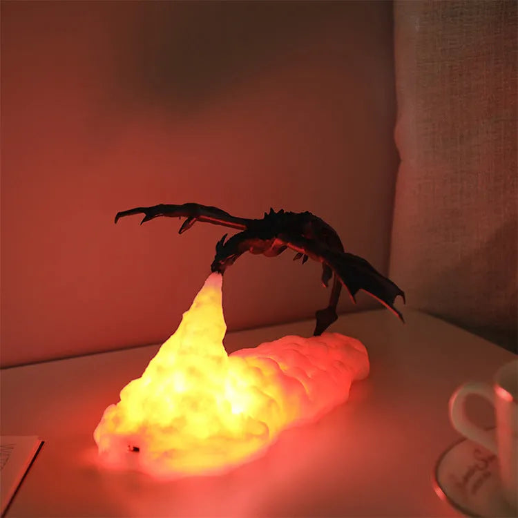3D printed red dragon night light with USB charging cable on a dark surface